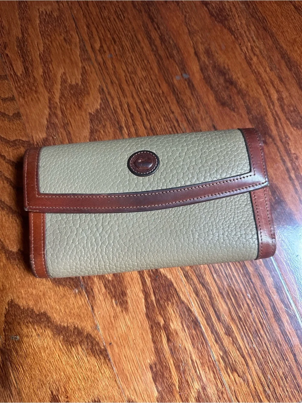 Dooney & Bourke Classic Pebbled Leather Wallet with Brown Trim